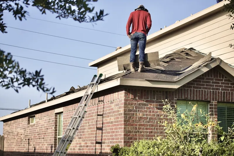 Professional roofer working on a residential roof in Lakeland Estates